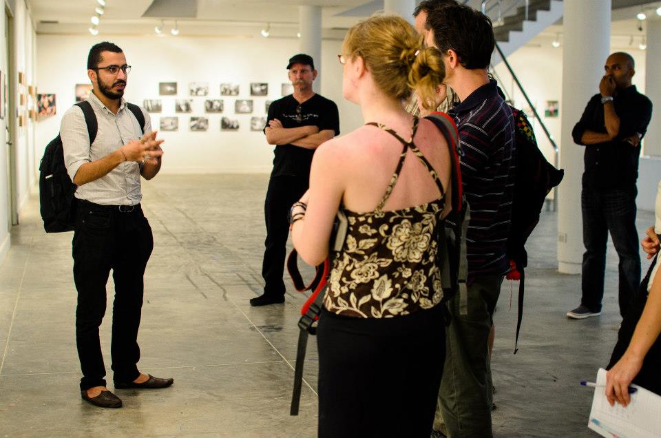 Manik Katyal giving an exhibition tour about 'KASHMIR' exhibition, presented at Chiang Mai Documentary Festival, Thailand